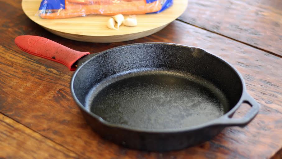 Lodge Cast Iron Skillet with Red Mini Silicone Hot Handle Holder